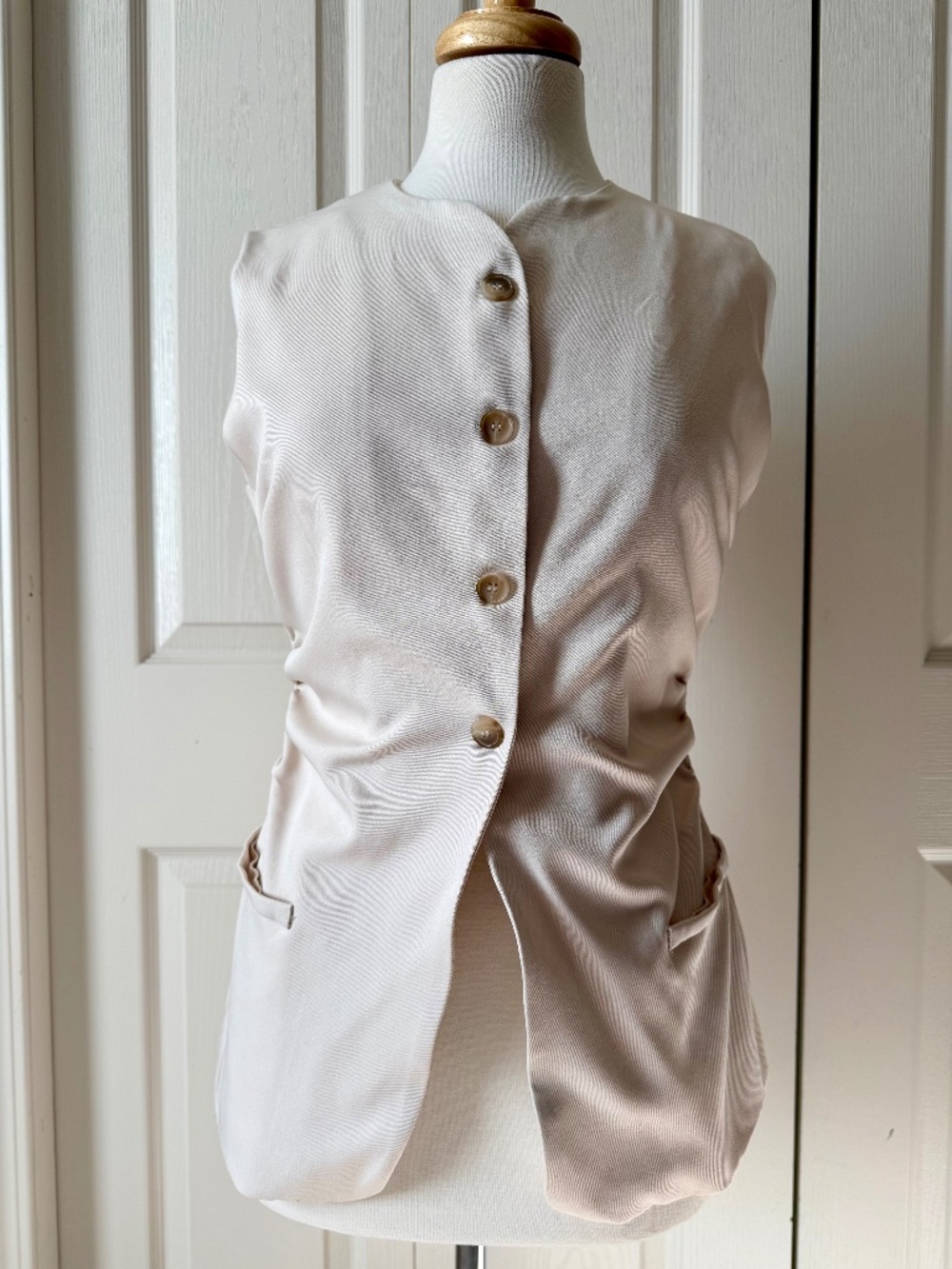 Cream sleeveless blouse